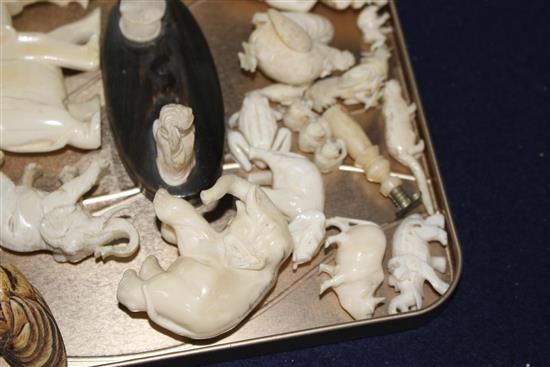 A group of assorted pre WWII ivory carving, mostly animals, together with several resin carvings